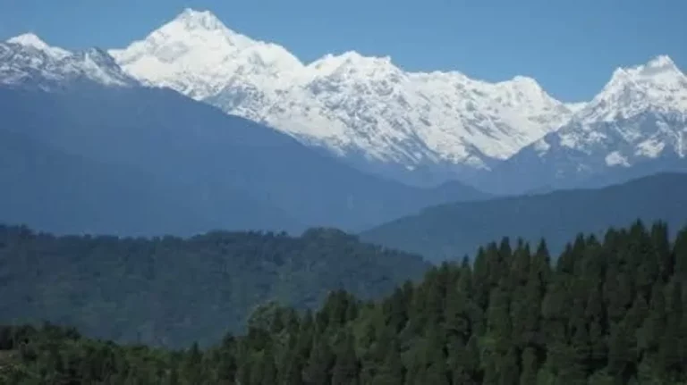 Flying over the Himalayan mountains in a helicopter.